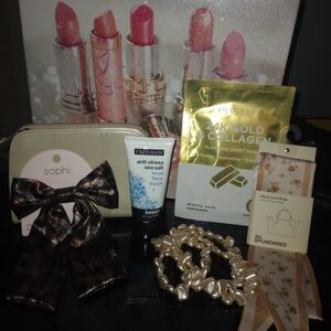 Estee Lauder Cosmetic Bag With Various Beauty Items